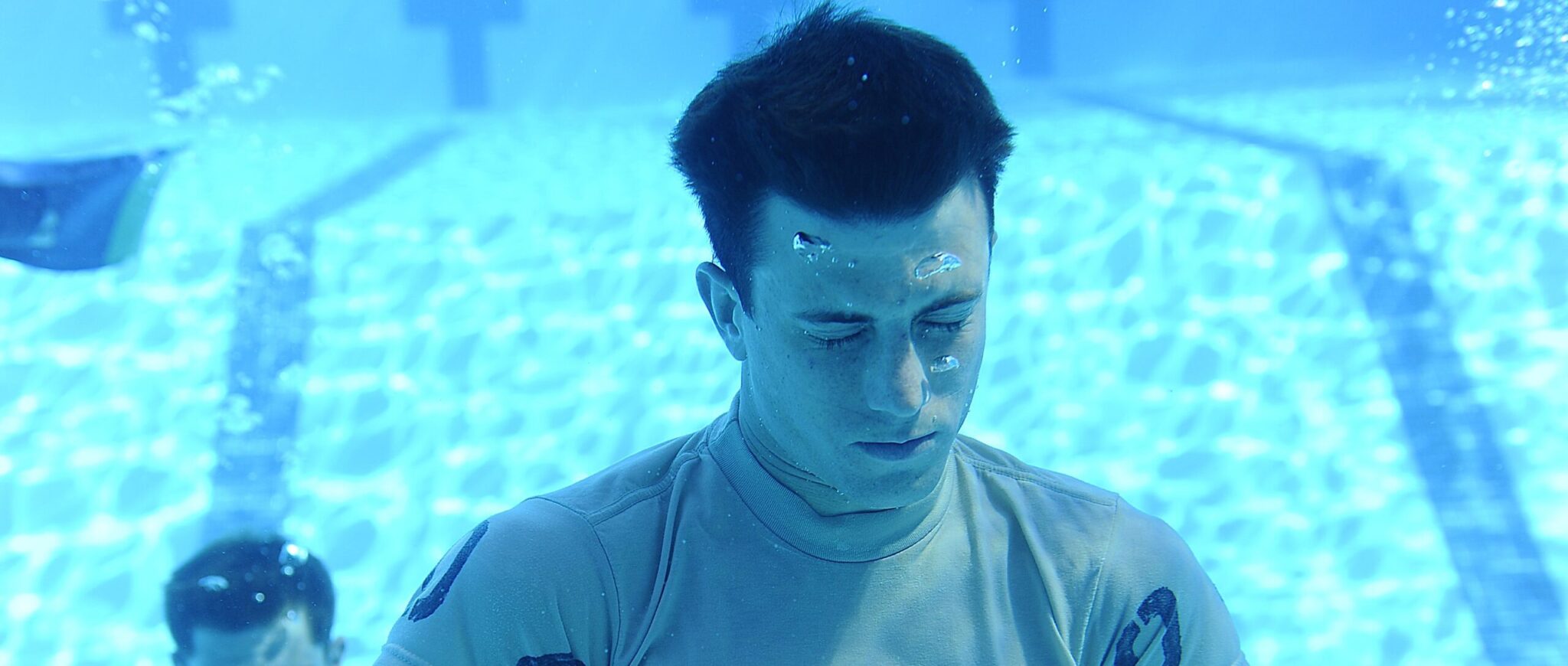 Male underwater holding breath